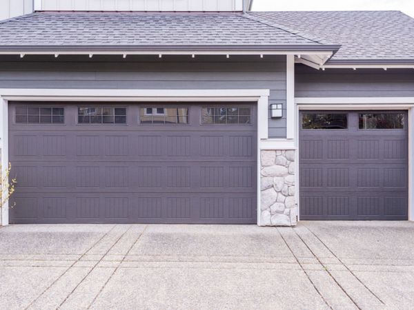 3 car garage with double door and single doors with top windows